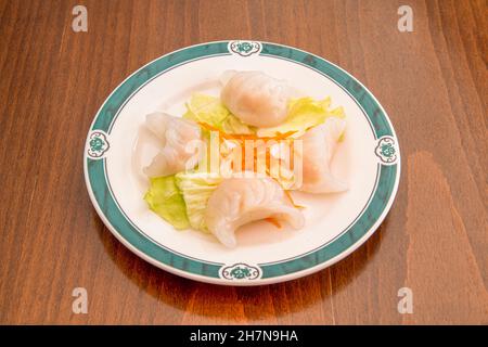 Un jiaozi, également connu sous le nom de mandu, est un type de boulettes ou raviolis typique de la cuisine chinoise très populaire en Chine, au Japon et en Corée, ainsi qu'en outsi Banque D'Images