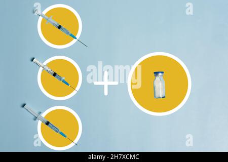 Seringues sur fond bleu clair.Symbole de trois tirs de rappel Covid-19.Injection de dose de rappel du vaccin Banque D'Images