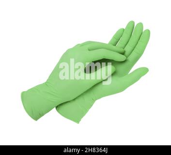 Gants médicaux.Deux gants chirurgicaux verts isolés sur fond blanc avec les mains.Fabrication de gants en caoutchouc, la main humaine porte un gant en latex Banque D'Images