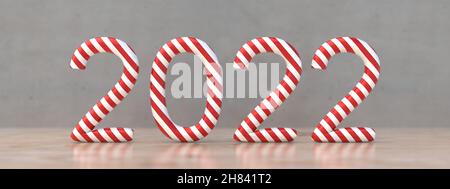 Nouvel an 2022 en forme de bâton de bonbons sur une table en bois, Numéro comme Noël rayé menthe poivrée de Noël traditionnel sucettes.illustration 3d Banque D'Images