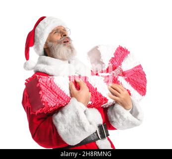 Père Noël avec pinata de canne à sucre isolé sur blanc Banque D'Images