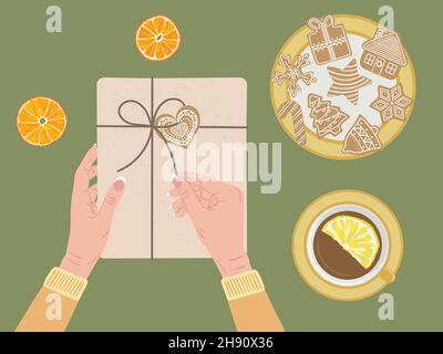 Boîte-cadeau blanche à mains ouvertes emballée dans du papier kraft et un ruban à ficelle.Vue de dessus, orange sec, cannelle, tasse de thé, biscuits au pain d'épice.ECO Christ Illustration de Vecteur