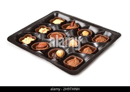 Collection de bonbons au chocolat dans une boîte en plastique. Banque D'Images