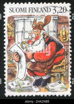 FINLANDE - VERS 1996: Timbre imprimé par la Finlande, montre Santa Reading Letters, vers 1996 Banque D'Images