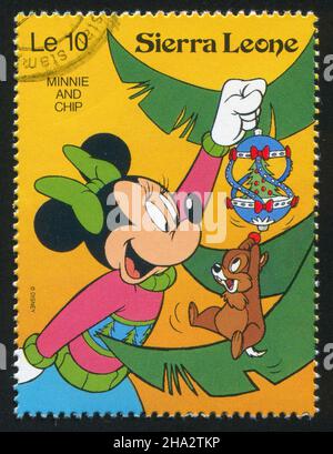 SIERRA LEONE - VERS 1992: Timbre imprimé par Sierra Leone, montre les personnages de Walt Disney dans les scènes de Noël, vers 1992. Banque D'Images