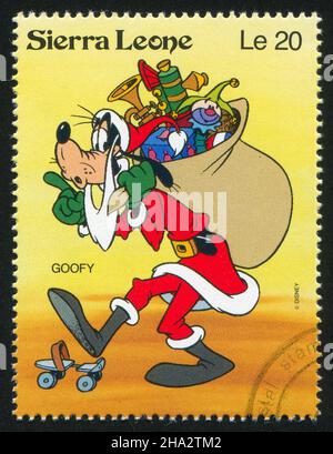 SIERRA LEONE - VERS 1992: Timbre imprimé par Sierra Leone, montre les personnages de Walt Disney dans les scènes de Noël, vers 1992. Banque D'Images