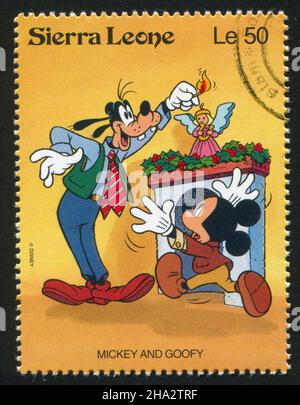 SIERRA LEONE - VERS 1992: Timbre imprimé par Sierra Leone, montre les personnages de Walt Disney dans les scènes de Noël, vers 1992. Banque D'Images