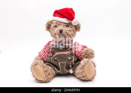 ours en peluche avec pantalon en cuir et chapeau de noël Banque D'Images