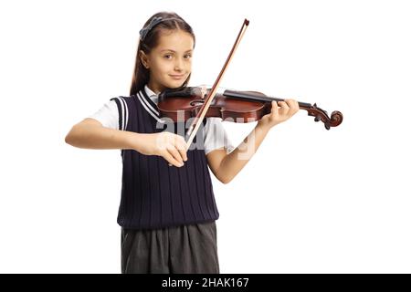 Fille dans un uniforme d'école jouant un violon isolé sur fond blanc Banque D'Images