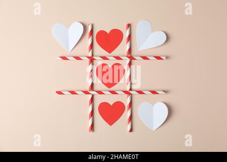 Concept de la Saint-Valentin avec pointe TAC sur fond beige Banque D'Images