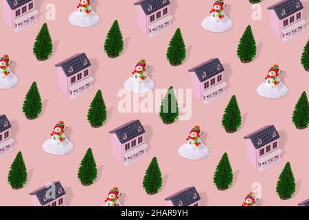 Paysage d'hiver suburbain concept de motif minimal avec maison rose, arbre de Noël et bonhomme de neige sur un fond pastel.Immobilier résidentiel, maintenir Banque D'Images