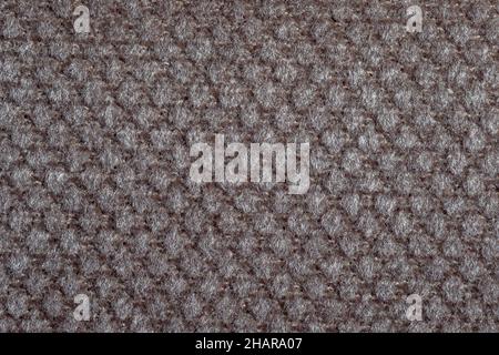 Texture grise du tissu.Tissus d'ameublement.Motif en relief.Fibres tissées.Le matériau est doux au toucher.Concept de minimalisme.Macro haute précision Banque D'Images