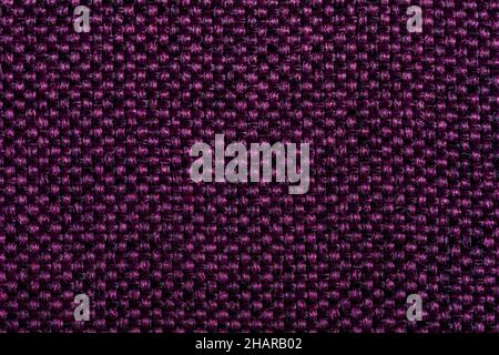 Texture de tissu violet. Textiles de rembourrage pour meubles. Motif gaufré. Fibres tissées. Le matériau est doux au toucher. Concept de minimalisme. Détail élevé Banque D'Images