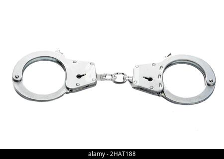 Menottes métalliques sur fond blanc isolé Banque D'Images