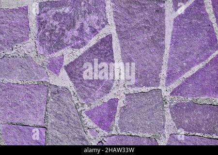 Trottoir violet en vieille pierre.Texture sans couture.Texture d'une route en pierre.Photo de haute qualité Banque D'Images
