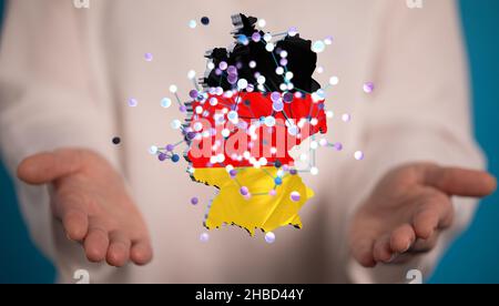 Un rendu en 3D de la carte numérique de l'Allemagne dans les mains d'une personne Banque D'Images