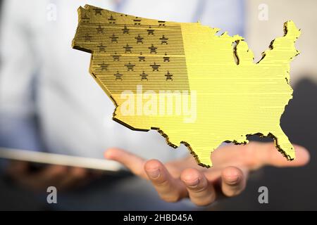 Un rendu en 3D de la carte d'or des États-Unis d'Amérique dans les mains d'une personne Banque D'Images