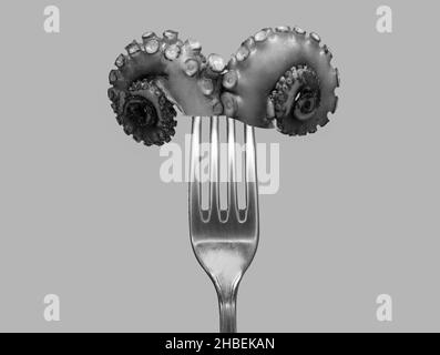 Poulpes tentacules sur une fourchette représentant un symbole de RAM d'Bélier conceptuel Banque D'Images