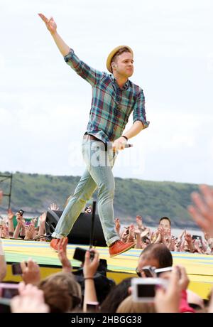 Olly murs se produit au T4 sur la plage de Weston Supermare le 10,2011 juillet. Banque D'Images