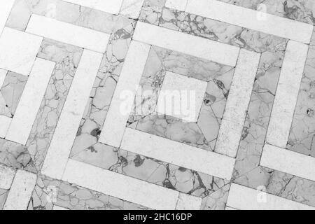 Carrelage en mosaïque de pierre de style rétro avec motif géométrique gris et blanc, texture de la photo d'arrière-plan Banque D'Images