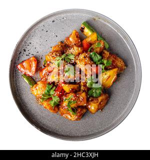 Poisson de zander asiatique isolé en sauce aigre-douce Banque D'Images