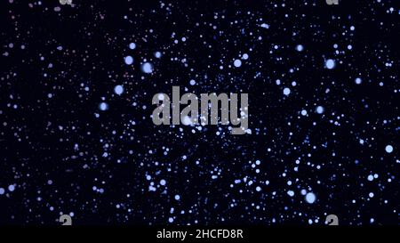 De nombreuses particules bleues, violettes, en rotation dans l'espace sur fond noir.Nuage coloré de petits cercles tournant, boucle sans couture. Banque D'Images