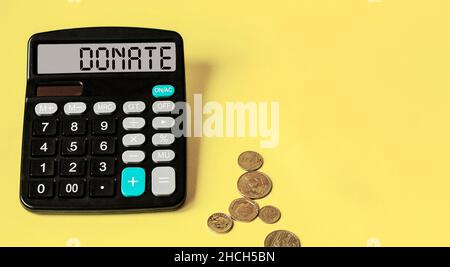 Calculatrice avec le mot DON affiché.Concept commercial, fiscal et financier. Banque D'Images