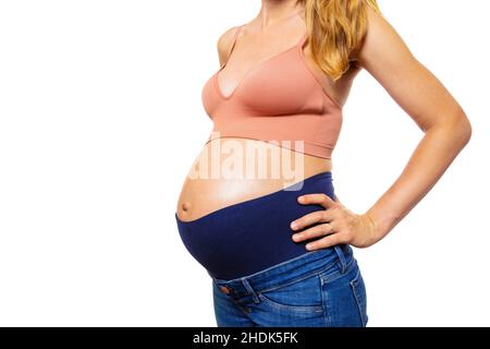 Femme enceinte en pantalon de maternité vue rapprochée Banque D'Images