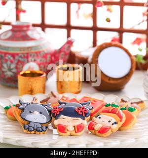 Personnage chinois de biscuits au sucre glace Imlek du nouvel an. Banque D'Images