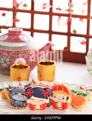 Personnage chinois de biscuits au sucre glace Imlek du nouvel an. Banque D'Images