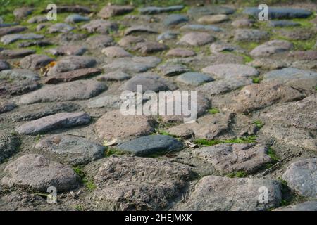 Fond naturel avec pierres.Belle structure en pierres rugueuses dans une couverture décorative sur le sol en gros plan.Blocs comme un antique, artistique, ou Banque D'Images