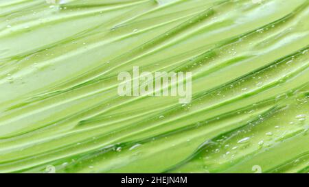 Gel cosmétique naturel à base de plantes.Sérum Vert transparent surface liquide comme fond de couleur.Soins de la peau Santé et beauté.Longue bannière Web. Banque D'Images