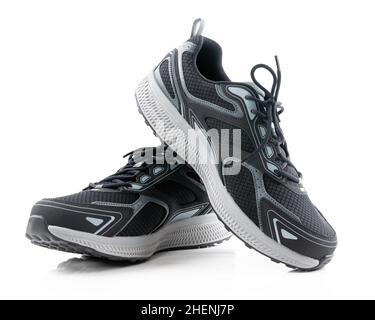 Paire de chaussures de sport noires isolées sur fond blanc Banque D'Images Paire de chaussures de sport noires isolées sur fond blanc Banque D'Images