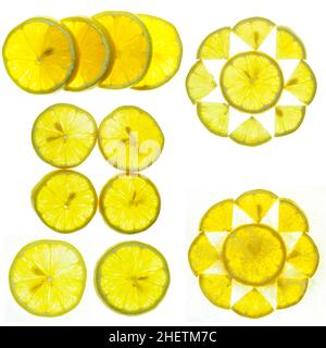 Morceaux de citron.Ensemble de citron vert frais, juteux et aigre bio tranché sur une surface blanche.Nourriture, fruits et objet alimentaire sain.Gros plan de citron Banque D'Images
