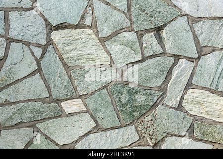 La section de mur en pierre avec des formes et des lignes Banque D'Images