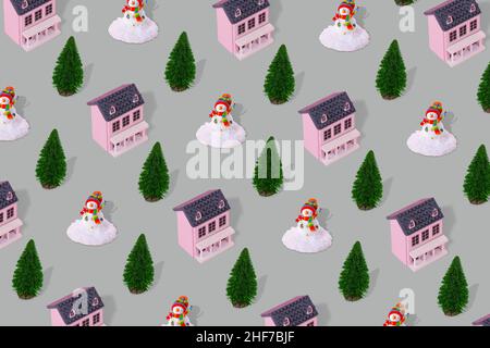 Paysage d'hiver suburbain concept de motif minimal avec maison rose, arbre de Noël et bonhomme de neige sur fond gris.Immobilier résidentiel, soutient Banque D'Images