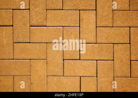 motif de chaussée composé de blocs de béton coulé de couleur jaune Banque D'Images