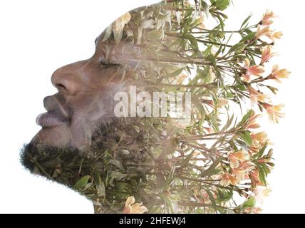 Portrait d'un homme se dissolvant en fleurs dans une technique de double exposition. Banque D'Images