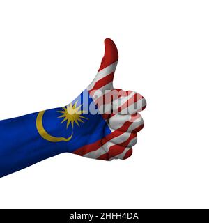Signe de fabrication des pouces vers le haut, malaisie peinte avec le drapeau comme symbole des pouces vers le haut, comme, OK, positif - isolé sur fond blanc Banque D'Images