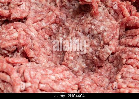 Bœuf fraîchement moulu.Texture et arrière-plan de la viande hachée Banque D'Images