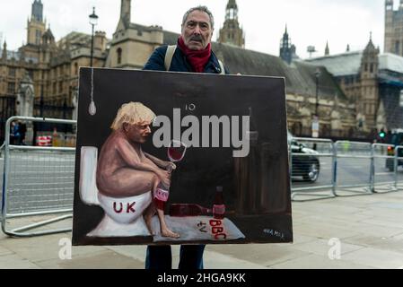 Londres, Royaume-Uni.19 janvier 2022.L'artiste satirique Kaya Mar, devant les chambres du Parlement, présente son dernier ouvrage représentant Boris Johnson.Le premier ministre fait face à la pression des députés ainsi que des membres de son propre parti pour démissionner suite à la découverte que les partis avaient eu lieu à Downing Street à un moment où de telles activités ont été interdites.Credit: Stephen Chung / Alamy Live News Banque D'Images