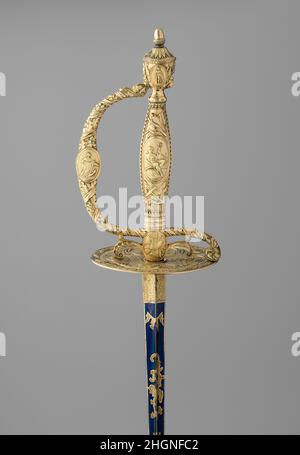 Smallsabre au fourreau et à la casse pour 1798–99 Michael Barnett la tradition de présenter des cadeaux d'armure et d'armes finement faites est ancienne.Les épées, comme le côté coutumier d'un guerrier et, à partir du Moyen-âge, un symbole de la chivalerie, ont été particulièrement favorisées.A partir du XVIIe siècle, de nombreux records survivent qui documentent les dons des épées avec des montures somptueusement décorées, habituellement travaillé dans des métaux précieux et parfois bijoux, présentés par un monarque ou un prince à des courtisans distingués, des diplomates et des héros militaires.C'était particulièrement vrai de la dura Banque D'Images