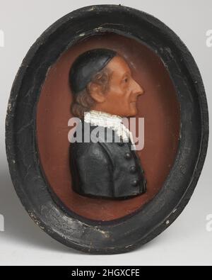 Portrait d'un religieux 18th siècle probablement britannique.Portrait d'un religieux. Probablement britannique.18th siècle.Cire de couleur sur ardoise (peinte en brun rougeâtre); cadre: Bois.Sculpture miniature Banque D'Images