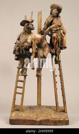 Descente de la Croix au début du 16th siècle le Sud-Netherlandish Nicodème et Joseph d'Arimathée retirent le corps du Christ de la croix.La sculpture, qui faisait autrefois partie d'un retable, reprend une composition établie par le peintre néerlandais Rogier van der Weyden.Descente de la Croix.Pays-Bas du Sud. Début du 16th siècle.Chêne, polychromie et dorure.Sculpture-Bois Banque D'Images