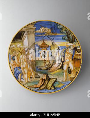 Plat d'Armorial : l'histoire du roi Anius 1532 Francesco Xanto Avelli da Rovigo Italien cette plaque fait partie de l'un des plus grands services de majolica jamais faits, commandé par Piero Maria Pucci (1467-1547),Membre d'une famille florentine éminente dont les armoiries sont en profil avec la tête d'un Noir, une référence à leur nom de famille original, Saracini (signifiant « Saracens »).Des images similaires sont souvent apparues dans l'héraldique européenne depuis le XIIIe siècle.Enracinée dans l'assujettissement des musulmans et des peuples d'origine arabe et africaine, cette imagerie a souvent signifié le triomphe de la Crusad Banque D'Images