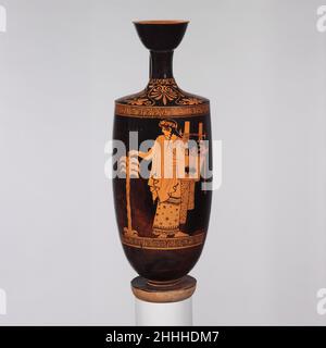 Terre cuite lekythos (ballon à huile) ca.460–450 C.-B. attribué à Nikon Painter Obverse, Apollo avec kithara (lyre) et arbre de palmerLito aurait donné naissance à Apollon sous un palmier dattier sur l'île cycladique de Delos, le site de l'un de ses plus importants sanctuaires.Lekythos de terre cuite (fiole à huile) 254795 : attribué à l'artiste-peintre Nikon, lekythos de terre cuite (fiole à huile), ca.460?450 C.-B., terre cuite, H. 15 po.(38,1 cm).Metropolitan Museum of Art, New York.Don de M. et de Mme Leon Pomerance, 1953 (53,224) Banque D'Images