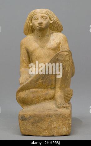 Statue d'un homme assis asymétrique ca.1981–1550 C.-B. Royaume du milieu–début du nouveau Royaume.Statue d'un homme assis de façon asymétrique 544175 Banque D'Images