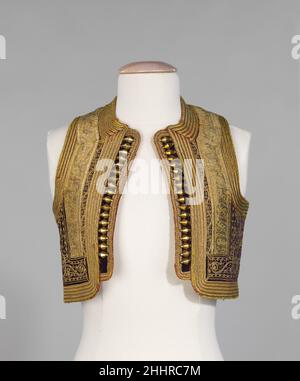 Gilet quatrième quart de 19th Albanais du siècle les couches d'embellissement de ce gilet albanais incluent la tresse d'or, la corde d'or dans un motif folié complexe; et les spides d'or.La doublure ikat à motifs ajoute une touche de fête.Gilet 159239 Banque D'Images