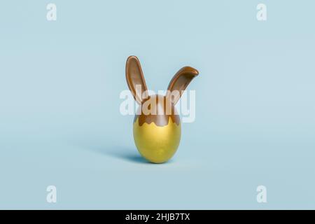 œuf de pâques doré aux oreilles de lapin en chocolat.3d rendu Banque D'Images