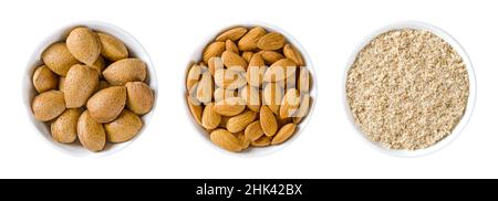 Amandes dans des bols blancs.Noix entières et séchées de Prunus dulcis, avec et sans coquilles, prêtes à manger comme encas, et noix moulées, utilisées pour la cuisson. Banque D'Images